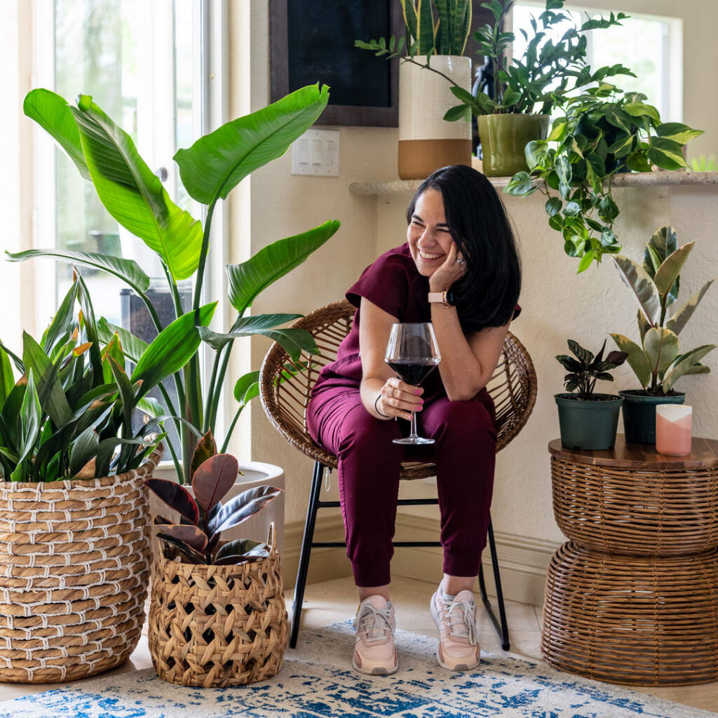 Drinking wine surrounded by plants